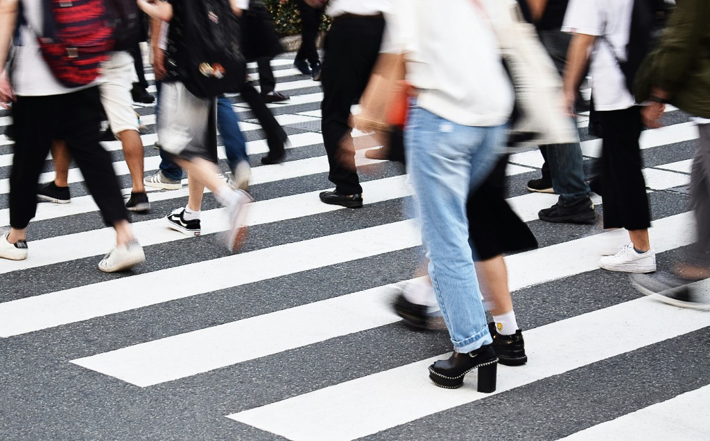 Dynamic street crosswalk motion blur photograph of people walking